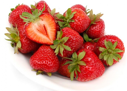 Cut strawberry fruit of Markat on a plate